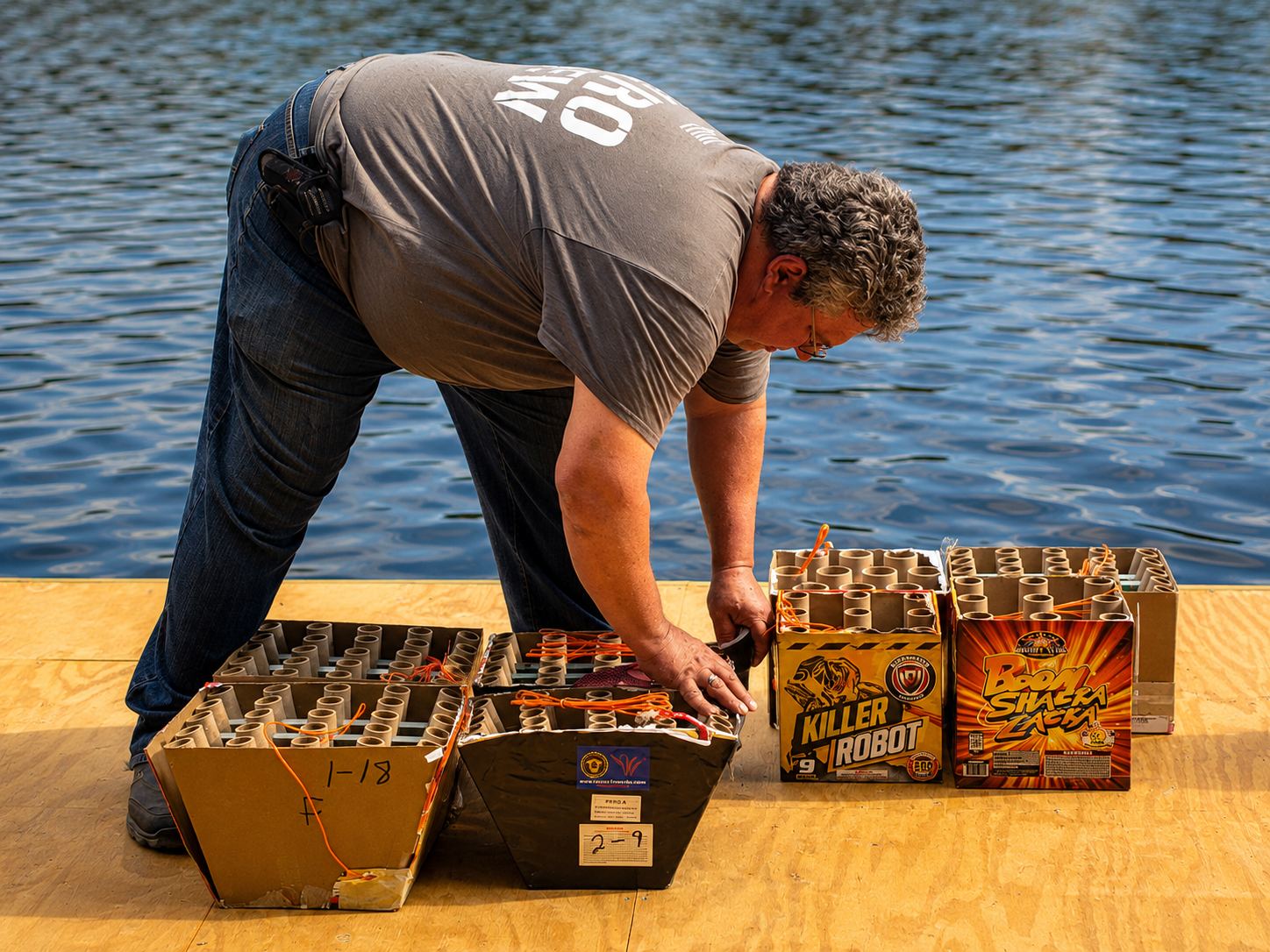Imperial Pyro crew loading mortar tubes on a fireworks barge