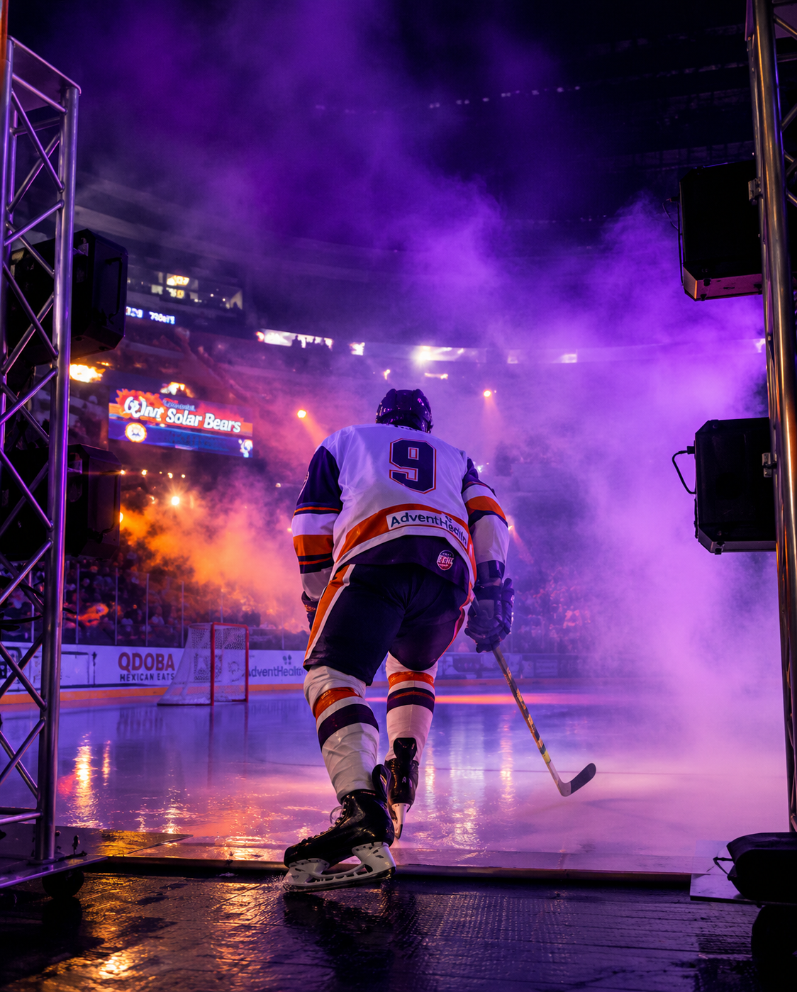 Orlando Solar Bears player entering the ice through fog at Kia Center &mdash; Imperial Pyro fog, light, and truss system