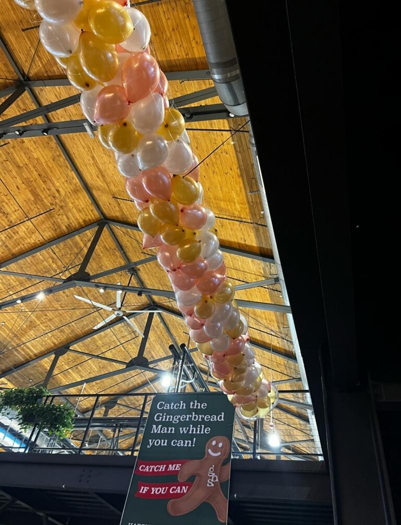Balloons suspended from the ceiling ahead of a New Year's Eve celebration