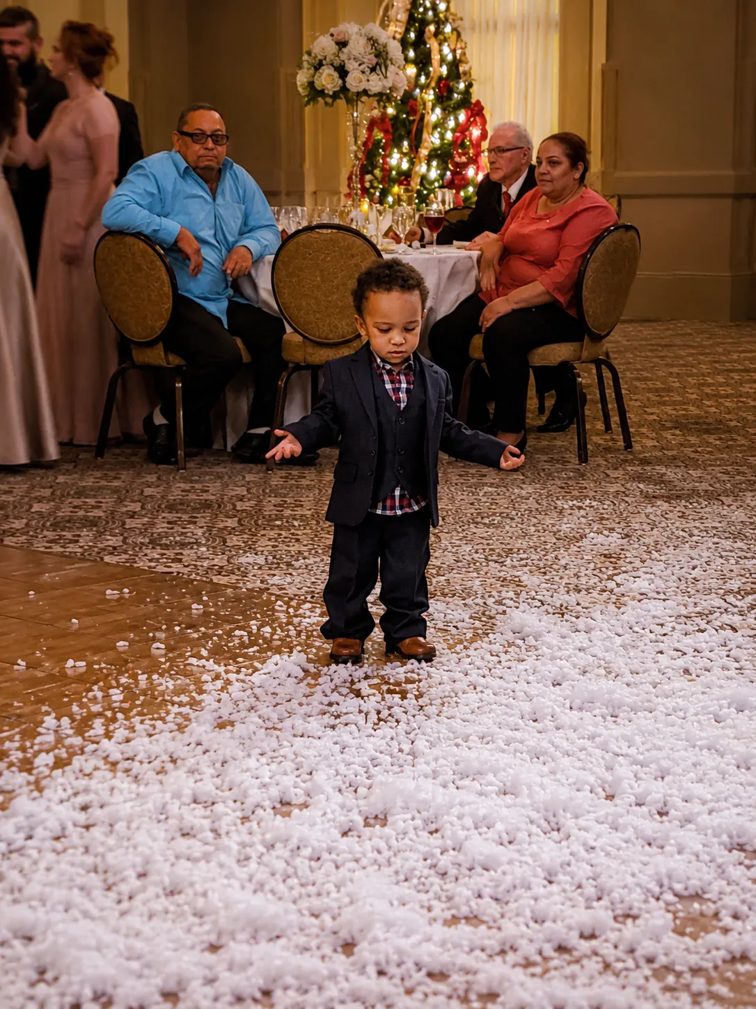 Indoor snow effect filling a venue during a winter event