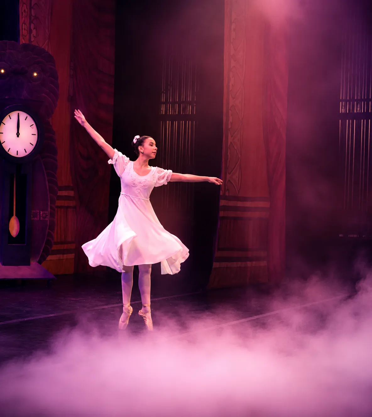 Low-lying stage fog surrounding a ballerina