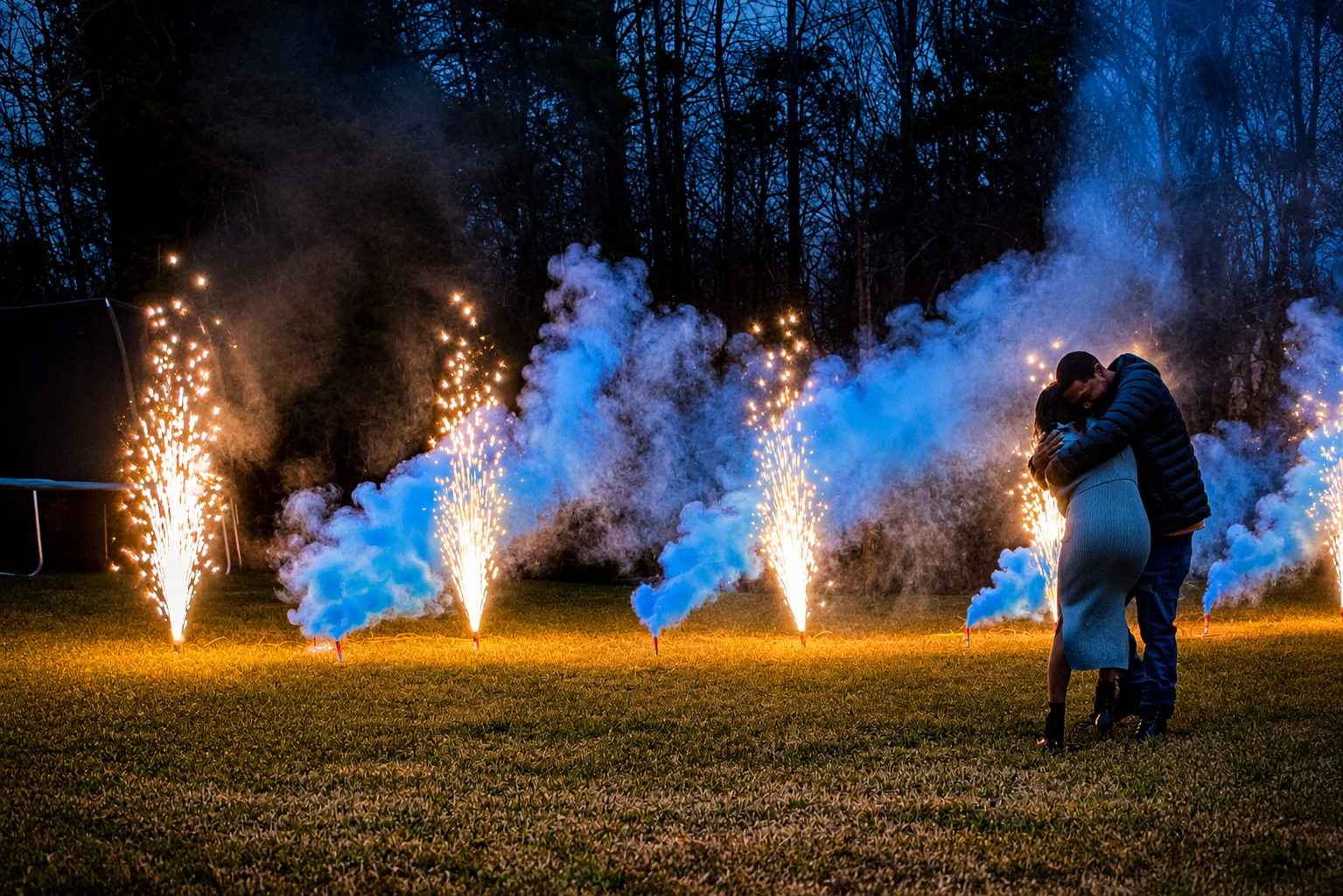 Blue smoke and cold sparks at a gender reveal
