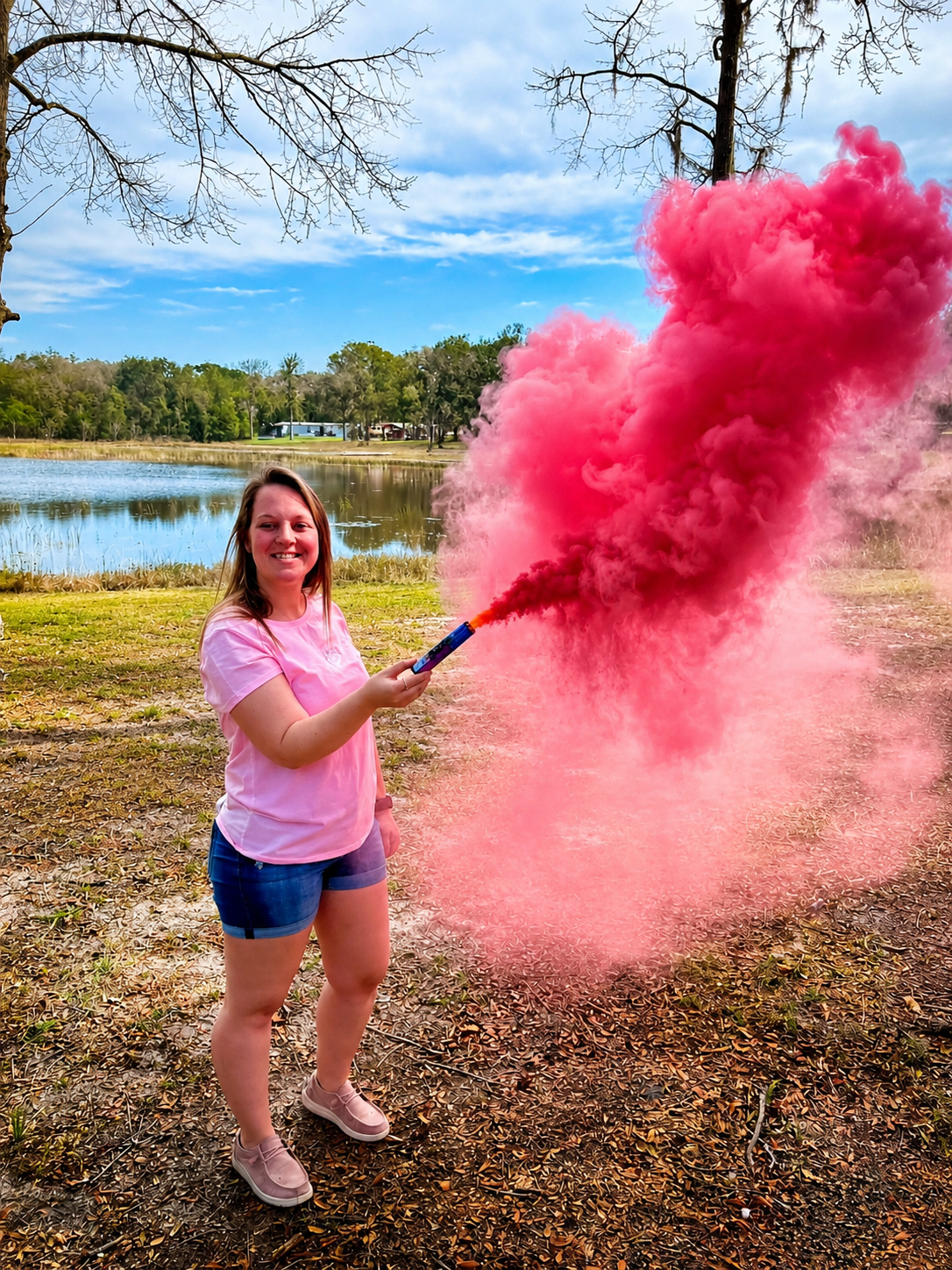Operator holding a pink smoke device