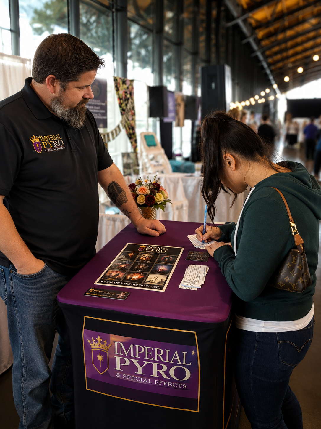 Consulting with a couple at a wedding expo
